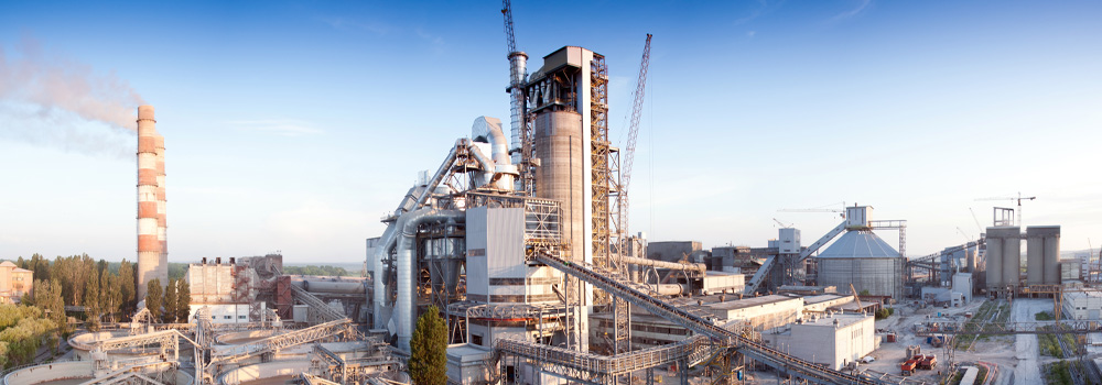 outside shot of a cement factory with blue sky
